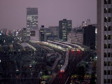 Elevated View of the Bullet Train at Tokyo Station at Twilight Photographie par Paul Chesley