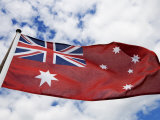 Naval Flag of Australia Flying under a Cloudy Sky Photographic Print by Mattias Klum