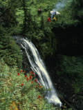 Horseback Riders Stop to Fix a Meal Near a Gentle Waterfall Photographie par Paul Chesley