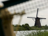 Windmills Along a Waterway in Holland Photographic Print by Mattias Klum