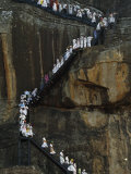 People Ascend and Descend a Steep Stairway on the Side of a Cliff Photographie par Paul Chesley