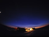 Winter Mining Camp at Night Photographie par Paul Nicklen