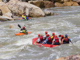 Kayakers and a Raft Down a Whitewater River Photographie par Skip Brown