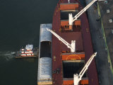 Tugboat Pushing Ship Up to the Docks in New Orleans Photographic Print by Tyrone Turner