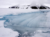 Meltwater Pool Drains into a Forming Crevasse on Jakeman Glacier Photographic Print by John Dunn