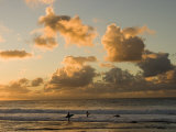 Two Surfers Enter the Pacific Ocean as the Sun Sets in Hawaii Photographic Print by Charles Kogod