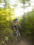 Woman Mountain Biking Through the Woods on a Summer Day Photographie par Skip Brown