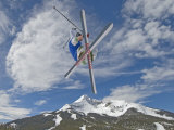 Skiing Aerial Maneuvers Off a Jump in a Terrain Park Photographic Print by Gordon Wiltsie