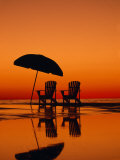 Picturesque Scene with Two Chairs and an Umbrella on the Beach Photographie par Michael Melford