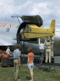 Men Load a Piper Cub into the Hold of a C-46 Photographie par Walter Meayers Edwards