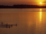 People Playing in the Mekong River at Sunset Photographie par Paul Chesley