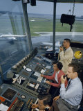 Air Traffic Controllers Direct Traffic from a Radio Console Fotografisk trykk av David Boyer Air Traffic Controllers Direct Traffic from a Radio Console Fotografisk trykk av David Boyer
