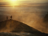 Two Silhouetted Men at Twilight Amid Geothermal Steam on Mountain Top Photographie par Paul Chesley