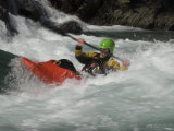 Young Kayaker Paddles in Waves on the Kananskis River, Near Calgary Photographie par Gordon Wiltsie