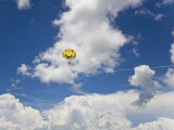 Two People in a Smiley Face Parasail in Partly Cloudy Blue Skies Photographic Print by Mike Theiss