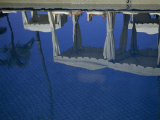 Pool Umbrellas and Cabanas Reflected in a Swimming Pool Photographie par Jodi Cobb