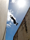 Parkour Practitioner Jumps a Building Gap in Adelaide, Sa Photographic Print by Brooke Whatnall