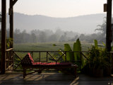 Lounge Chair in a Lush Setting Welcomes Tired Travelers Photographic Print by Rebecca Hale