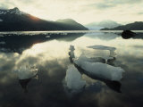 Melting Iceberg under a Cloud Filled Sky Photographie par Paul Chesley