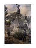 Man Stands Among Graves at a Church in Ploeven Photographie par Gervais Courtellemont