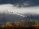 Clouds Cover the Hillside Near Mt. Moran in Grand Teton National Park Photographie par Jodi Cobb