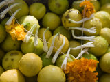 Garland of Flowers on a Pile of Limes Photographie par Abraham Nowitz