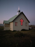 Small Church with a Cross Lit Up in Red Lights Photographie par Jodi Cobb
