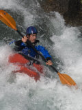 Young Kayaker Paddles in Waves on the Kananskis River, Near Calgary Photographic Print by Gordon Wiltsie