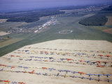 Colorful Airplanes are Parked in Rows at a Regional Airstrip Photographie par Jack Fletcher
