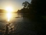 Young Boy Plays in Shallow Water of the Potomac River Photographie par Skip Brown