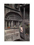 Two Women Stand by a Fan Window That Streams Sunlight into a Studio Photographie par Edwin L. Wisherd