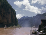 Sailing Junks and River Steamer Travel Past Steep Cliffs Photographie par W. Robert Moore