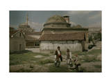 Three People in Turkish Enclave, Complete with Mosque and Minaret Photographic Print by Hans Hildenbrand