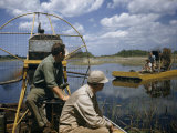 Men Ride Air Boats in Shallow Marshes Photographie par Willard Culver