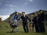 American Midshipman Twirls a Kilted Highland Dancer to Bagpipe Music Photographic Print by B. Anthony Stewart