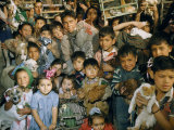 Children Crowd Together with their Pets for a Blessing of the Animals Lámina fotográfica por Justin Locke