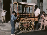 Children Gather by a Vendor Selling "Snowball" Treats Photographie par Edwin L. Wisherd