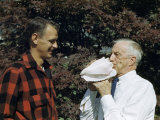 Man Blows Conch Shell Used as Horn by Ancestor in American Revolution Photographie par Walter Meayers Edwards