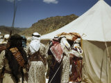 Soldiers in Traditional Dress and Cartridge Belts Stand Outside Tent Photographie par Maynard Owen Williams