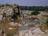 Men Paddle Canoes on a Tranquil Backwater Above Great Falls Photographie par Walter Meayers Edwards