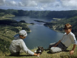 Men with Puppy Overlook Hourglass-Shaped Lakes in Volcanic Crater Photographie par Robert Sisson