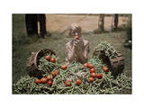 Girl Eating a Tomato, Sits Among the Vegetables from a Garden Photographie par Edwin L. Wisherd