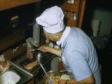 Man Wearing a Chef's Hat Grills Steaks in a Sailboat's Tiny Galley Photographie par Robert Sisson