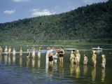 Girl Scouts and Counselors Stand in a Row Knee-Deep in a River Photographie par Walter Meayers Edwards