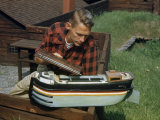 Tourist Inspects a Model of a Cargo-Carrying River Barge Photographie par Walter Meayers Edwards