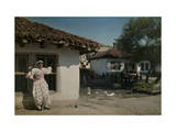 Slavic Gypsy Woman in Front of Her House Photographic Print by Hans Hildenbrand
