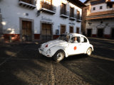 Man Driving a Volkswagen Taxi, Plaza Borda, Taxco, Guerrero, Mexico Photographic Print