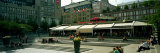 Tourists Sitting in a Park, Kungstradgarden, Stockholm, Sweden Photographic Print by Panoramic Images 