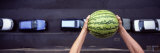 Person Dropping a Watermelon from High Above onto a Street Photographie par Panoramic Images 