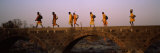 Indian Saints Walking on a Bridge, Orchha, Tikamgarh District, Madhya Pradesh, India Lámina fotográfica por Panoramic Images Indian Saints Walking on a Bridge, Orchha, Tikamgarh District, Madhya Pradesh, India Lámina fotográfica por Panoramic Images